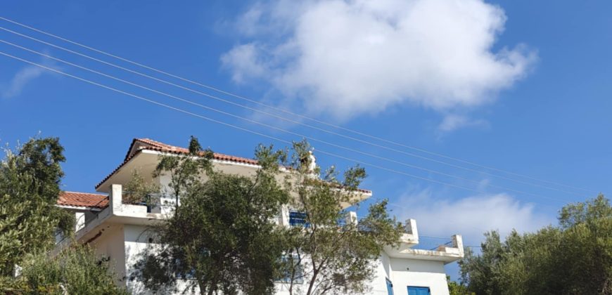 For sale a panoramic plot of 2,710.60 sq m. with two houses in Sivota, Thesprotia. 1,100,000€ (311)
